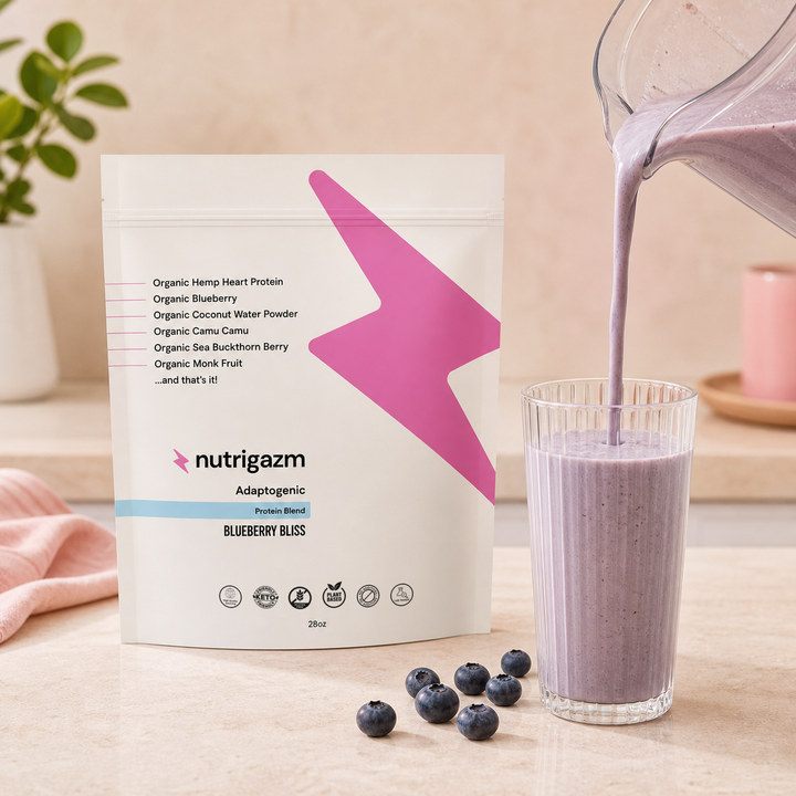 Blueberry Bliss protein shake being poured beside the Nutrigazm pouch