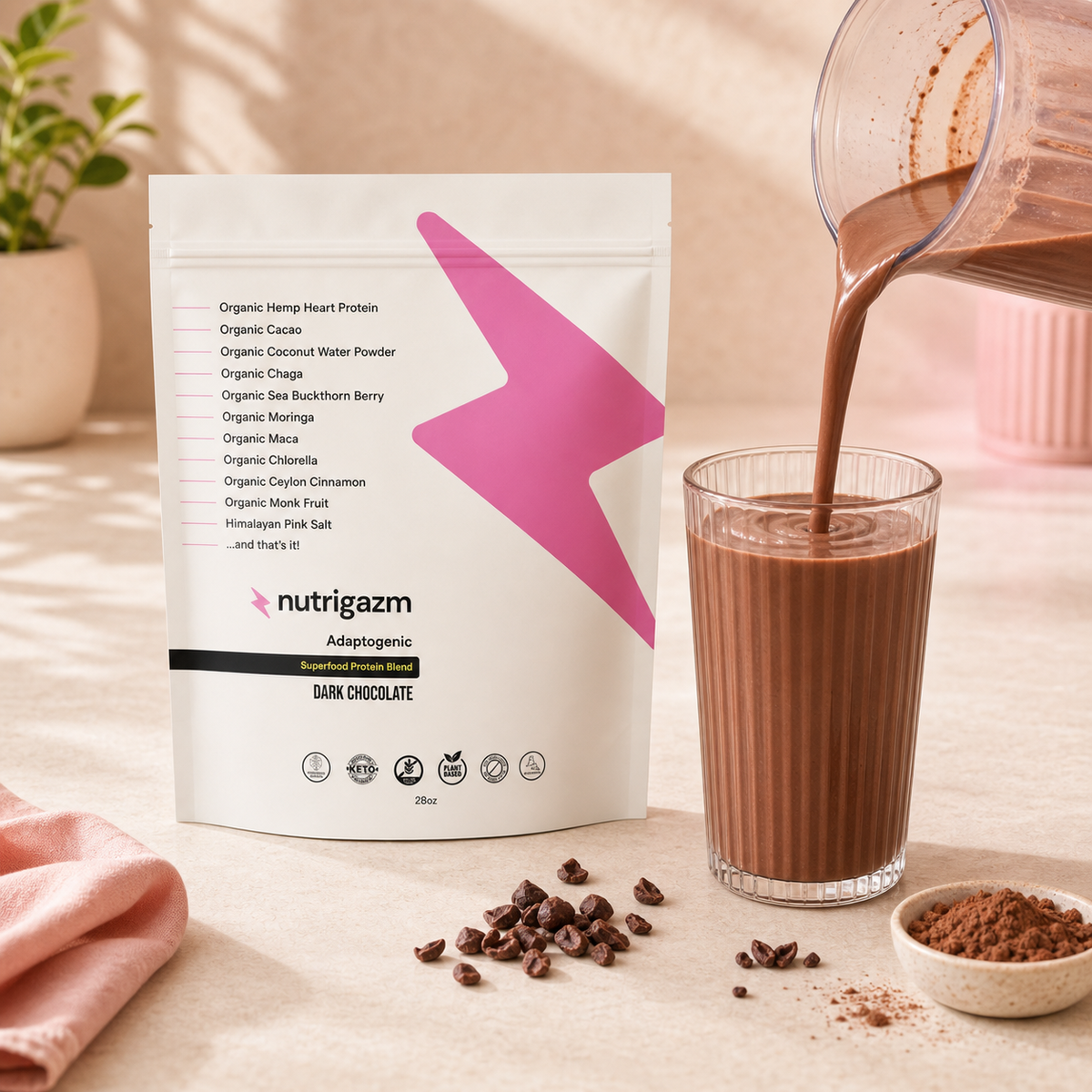 Dark Chocolate protein shake being poured beside the Nutrigazm pouch