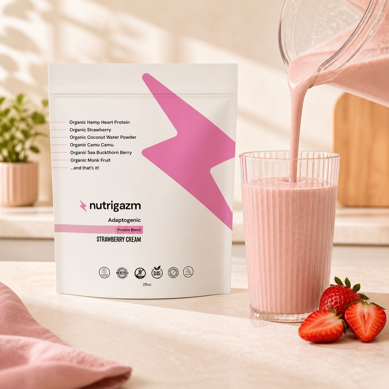 Strawberry Cream protein shake being poured beside the Nutrigazm pouch