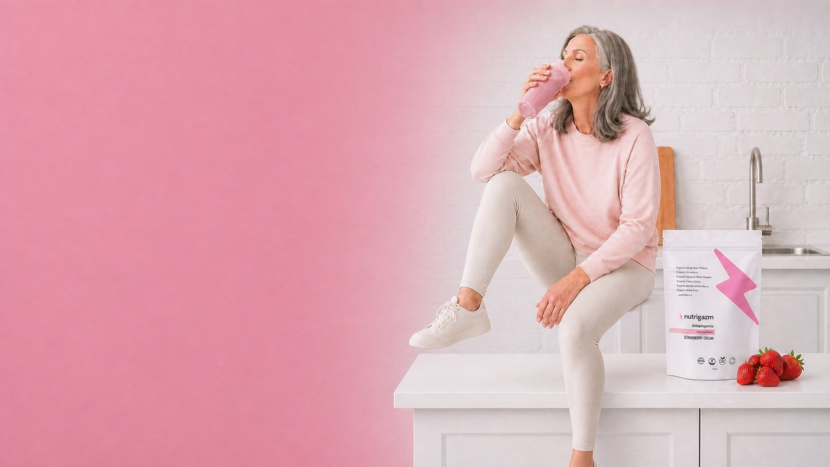 A woman enjoying a Nutrigazm chocolate protein drink.